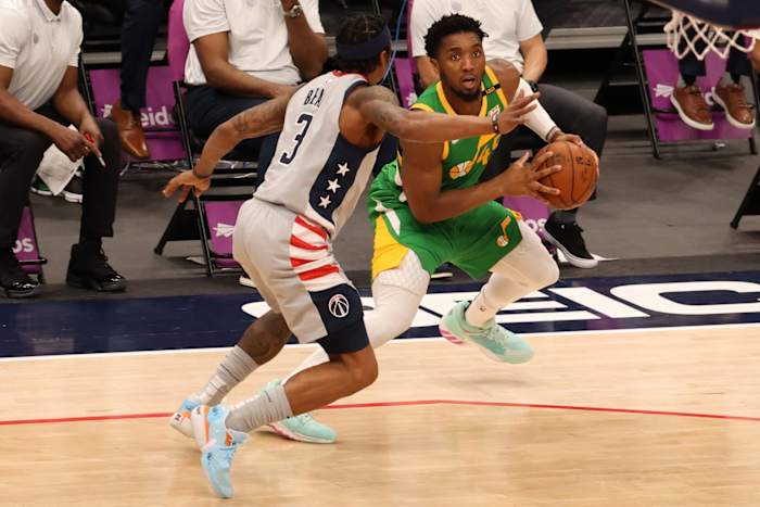 Donovan Mitchell (45) scores a step-back three-pointer over Bradley Beal (3)